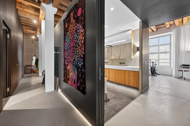 contemporary design, shower, countertop, cabinet, large mirror, wooden ceiling, trash bin