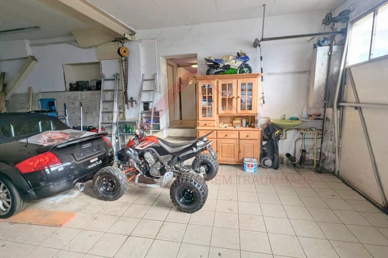 Casa multifamiliare nella zona centrale di Grossdietwil con spazio commerciale e potenziale di sviluppo polivalente (7)