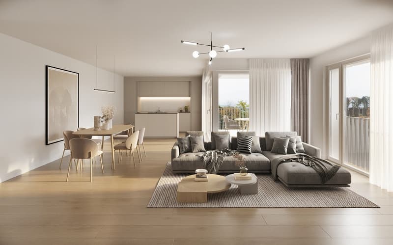 Spacious open-plan living area with a dining table, modern kitchen, and a large sofa in the living room. The room features large windows providing natural light and access to a balcony or terrace. The decor is minimalist and neutral-toned, with wooden flo