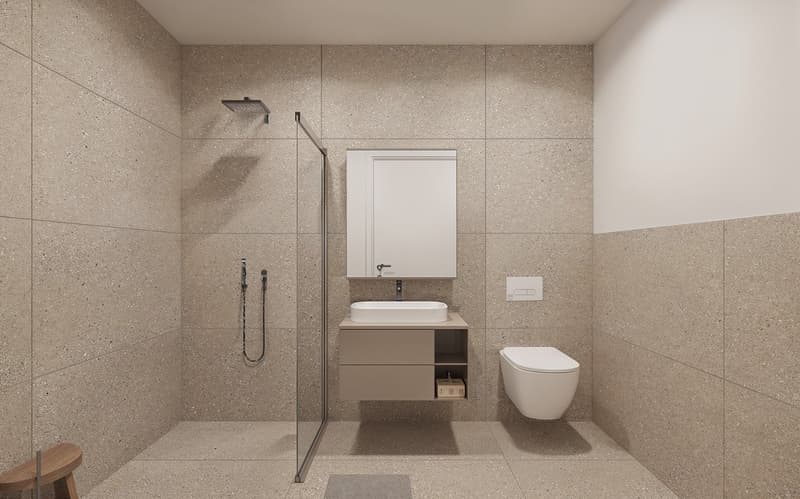 Modern bathroom with gray terrazzo-style tiles covering the walls and floor, a wall-mounted vanity with a vessel sink, a frameless glass shower enclosure, and a wall-mounted toilet. The bathroom also features a recessed medicine cabinet above the vanity a