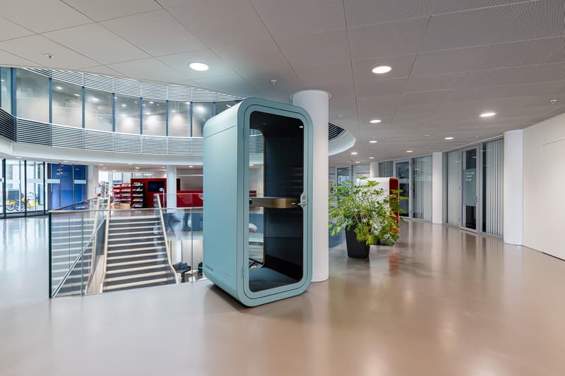 empty, large blue phone booth, modern ceiling, large staircase, modern floor design