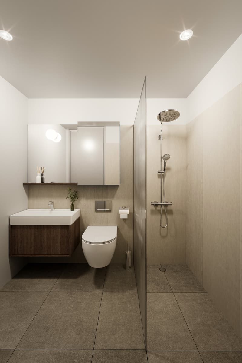 Modern small bathroom with a shower, toilet, sink, and wall-mounted mirror, with beige tiles and wooden cabinet