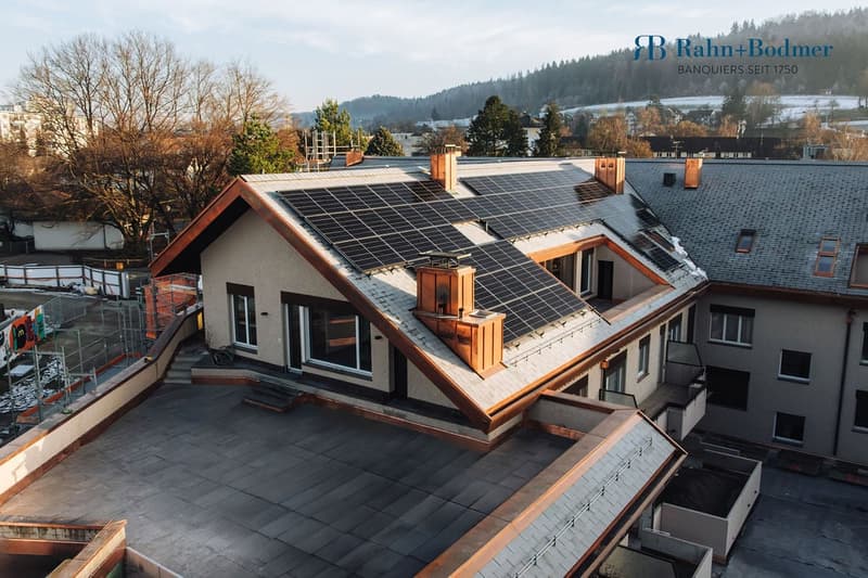 2 story house, solar panels on roof, red brick, white windows, modern architecture