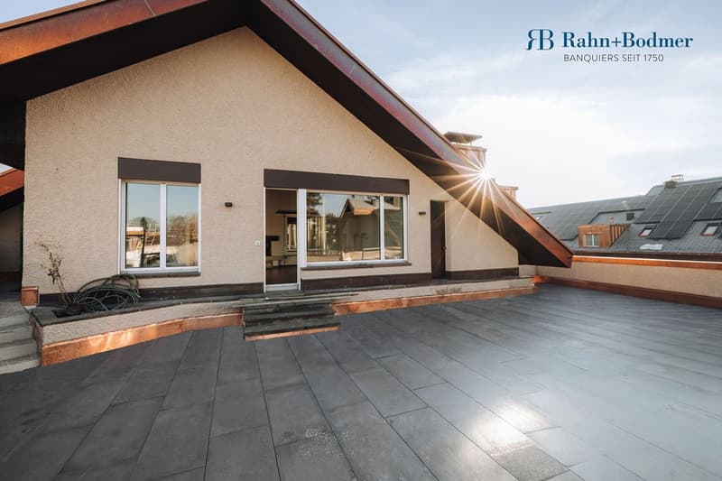 two story house, beige wall, grey tiled roof, solar panel on roof, black tiled terrace