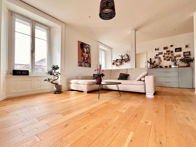 modern style, hardwood floors, large windows, painting, white couch, table, plants