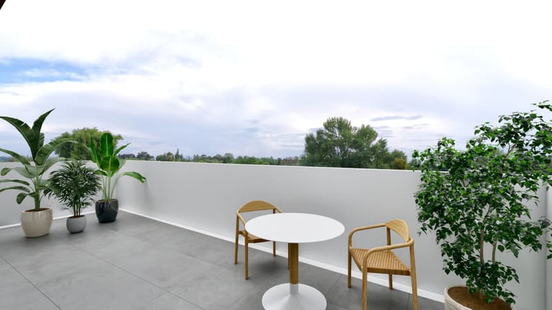 Balcony with wooden chairs, round table, potted plants, and city view