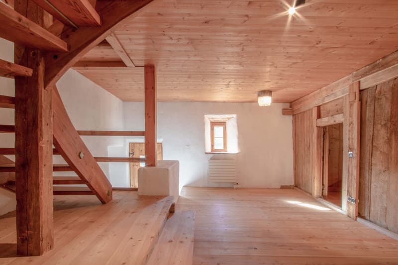 wooden beams ceiling, wooden staircase, white painted walls, wooden floor, small window