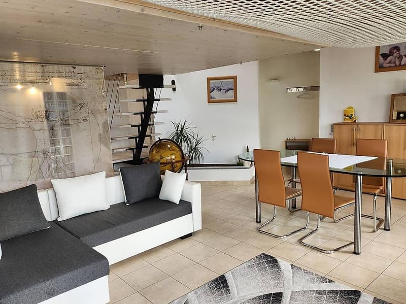 Modern style, white couch, white cushions, black rug, glass table, brown chairs, dining area
