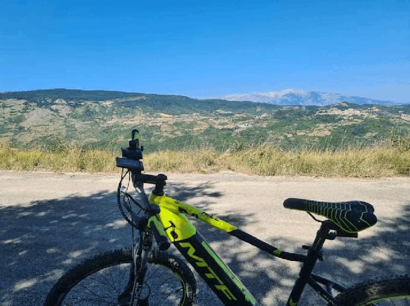 Road with a bike, mountains in the background