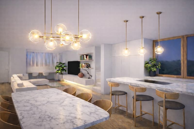 open space, large windows, kitchen with marble countertops, marble dining table, stools, couch, coffee table, plants, modern chandelier