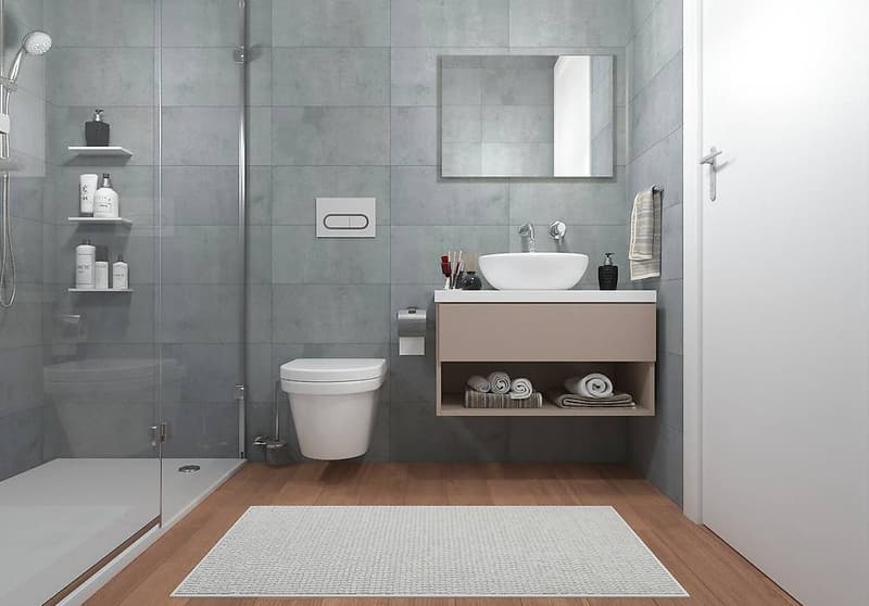 Bathroom with modern design, grey tiles, white wooden floor, rectangular bathtub, white toilet, white sink, and under-sink cabinet with shelves
