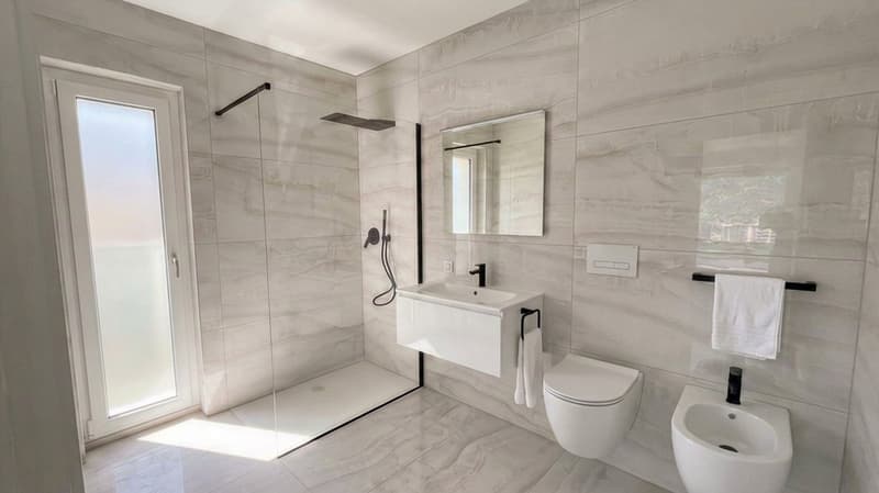 Moderno attico 3.5 locali con terrazze vista lago/monti (3)