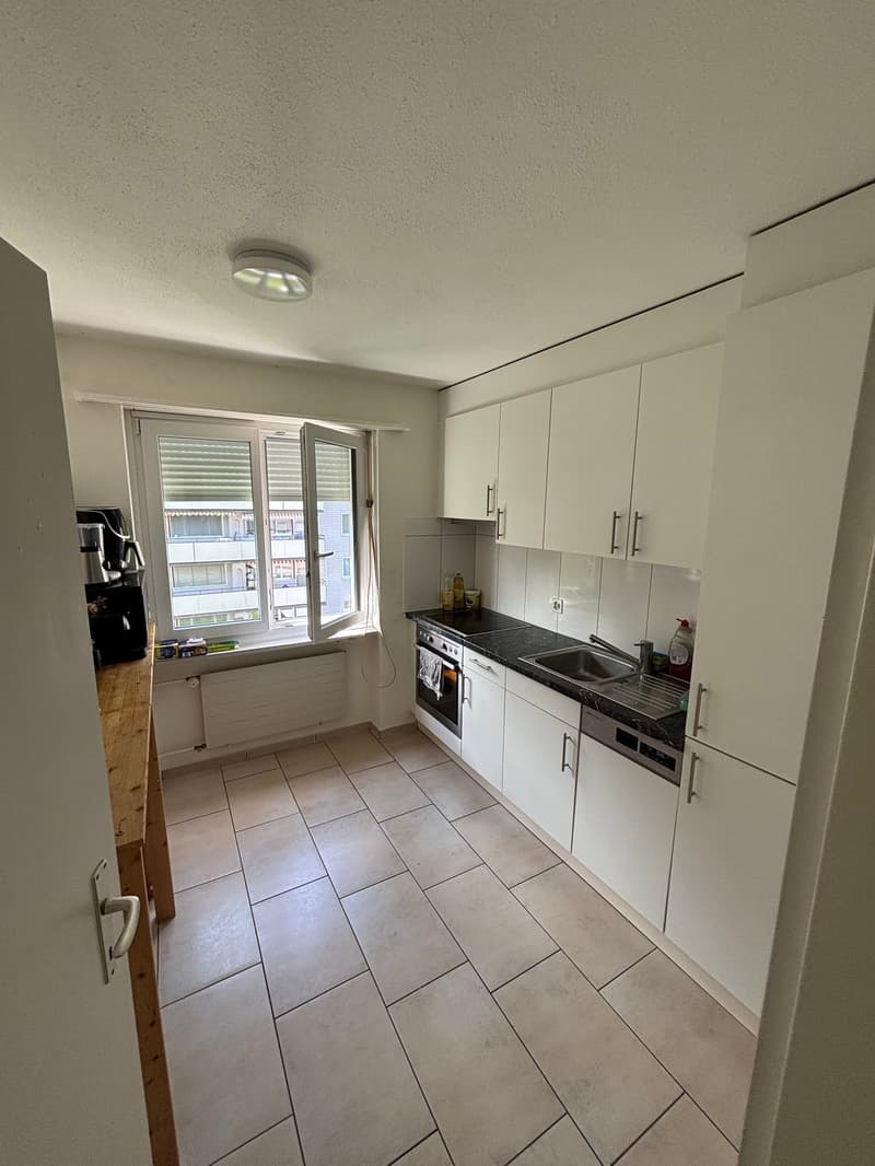 kitchen with white cabinets, tiled floor, sink, dishwasher, window, coffee machine