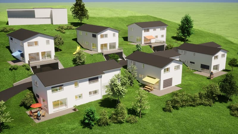 Several modern single-family houses with backyards and garages in a large, flat, grassy area.