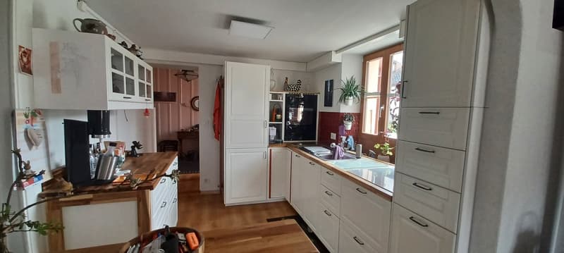 white cabinets, wooden countertops, integrated oven, dishwasher, sink, open shelving, small window