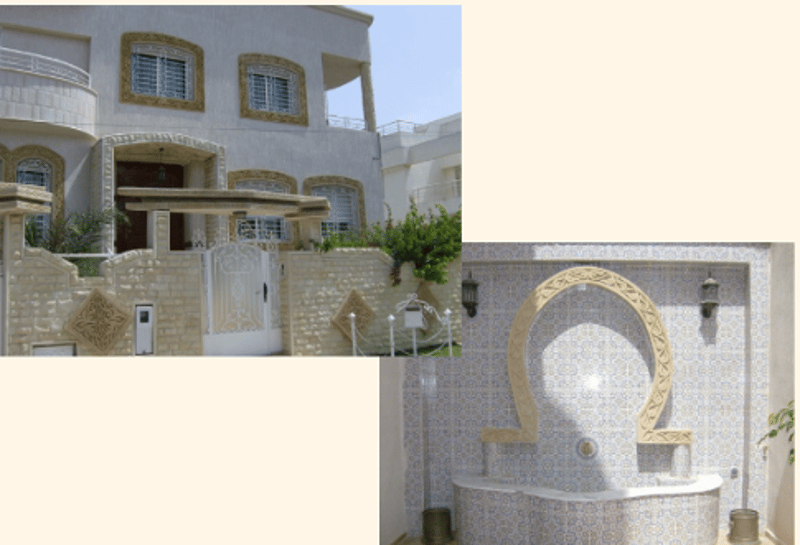 White facade, white windows, balcony on second floor, raised ground floor with intricate designs