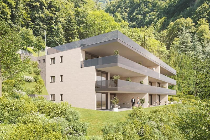 3 story building, balconies on each floor, multiple windows, entrance in the middle