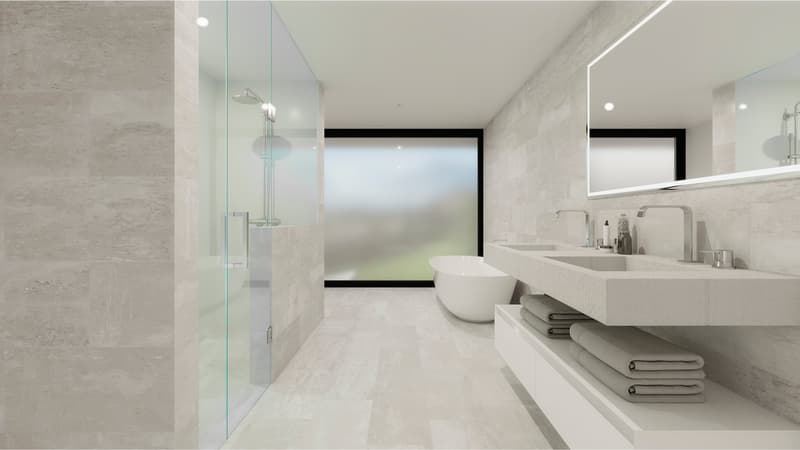 tiled wall, large mirror, glass shower door, bathtub, double sink with marble countertop, stacked towels