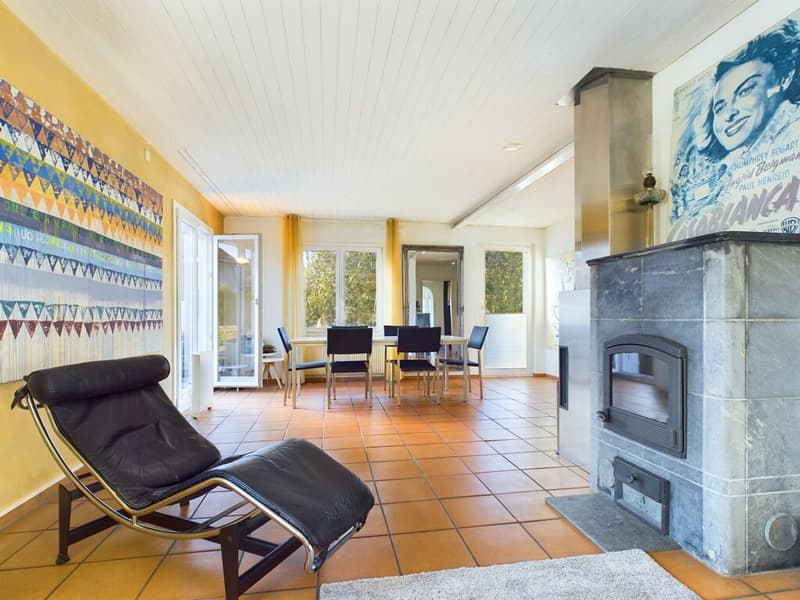 tiled floor, fireplace, decorative painting, chaise lounge, dining table, dining chairs