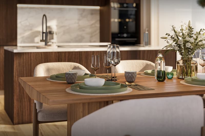 modern design, wooden cabinets, marble countertop, island with a sink, integrated appliances, large dining table, flower vase, wine glasses