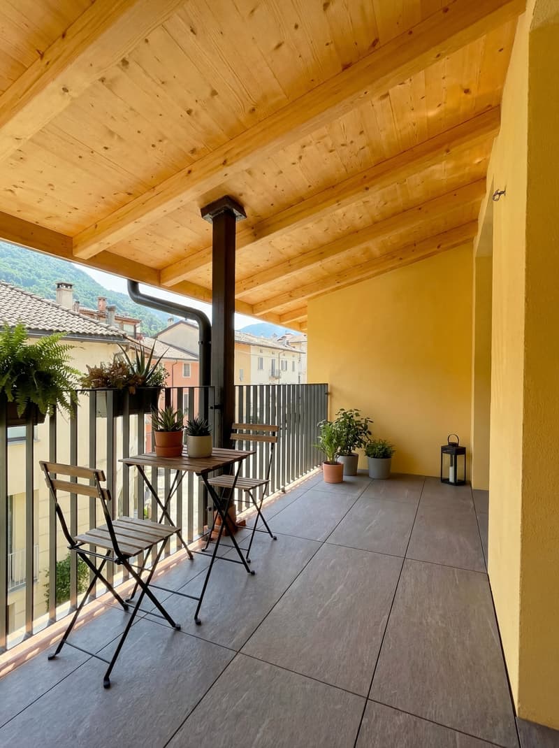 balcony with wooden ceiling, table and chairs, potted plants, metal railing, tiled floor, view of the mountains