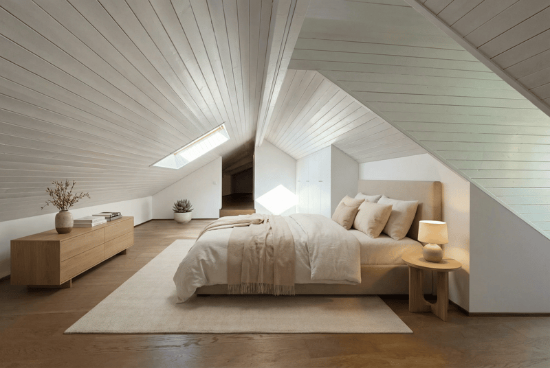 bedroom with bed, nightstand, lamp, rug, wooden cabinet, plants, wooden ceiling