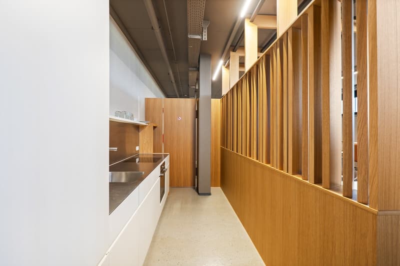 Kitchen area with sink, cabinets, and a dishwasher.