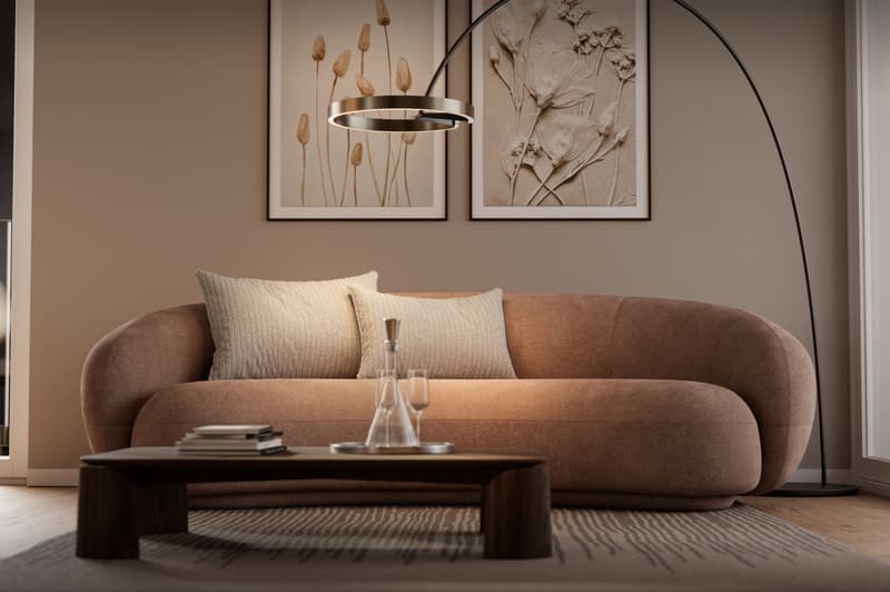 Modern living room with brown couch, coffee table, and decorative art pieces on wall