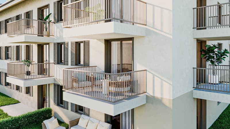 Modern apartment building with balconies, white exterior, wooden railings, green plants, and outdoor seating