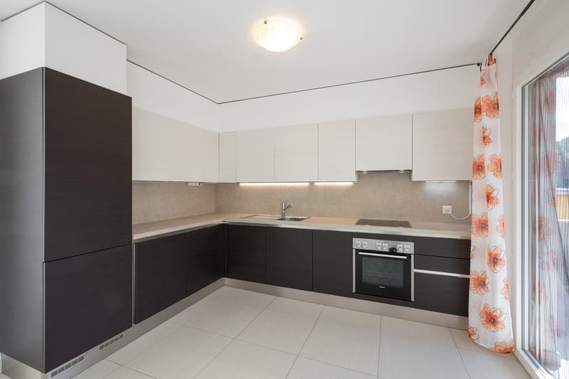 modern kitchen, white cabinets, black countertops, stainless steel appliances, white tile flooring