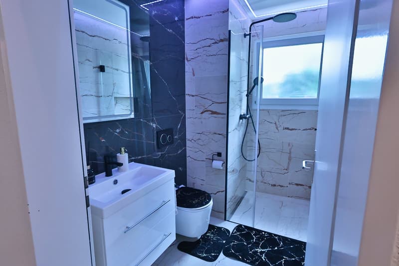 Moderne 4.5 Zimmer Wohnung mit 180 m² Garten (7)