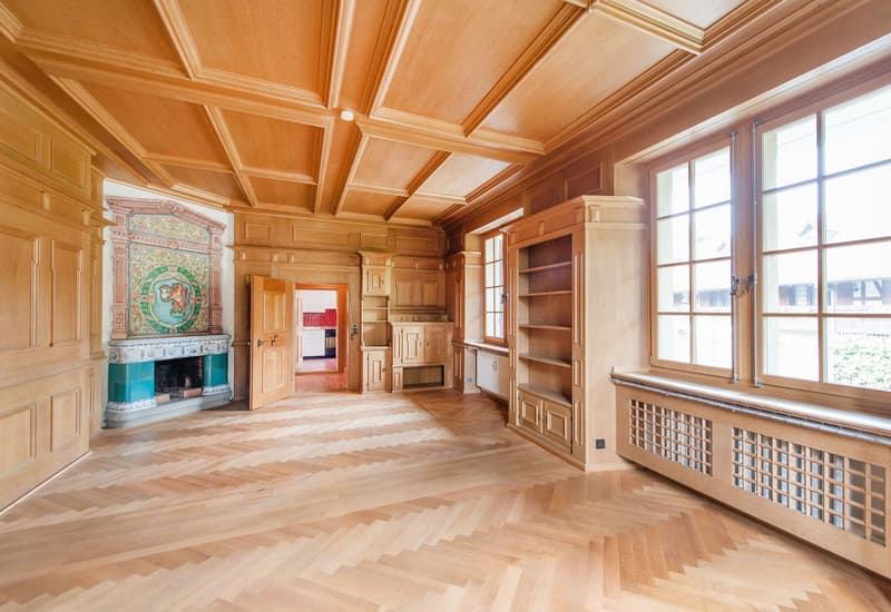 wooden floor, wooden walls, fireplace, large windows, wooden shelves, wooden door