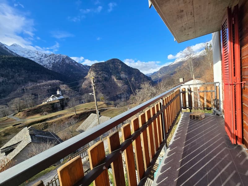 wooden railing, tiled floor, view of mountains