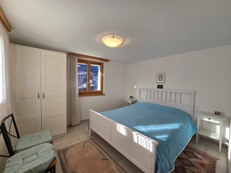 white walls, white bed, white nightstands, white wardrobe, carpet, window with view