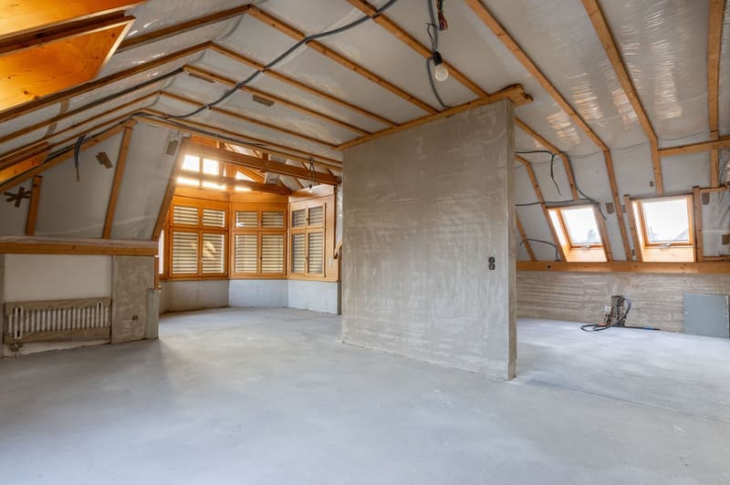 empty room, wooden beams, concrete wall, windows, pipes