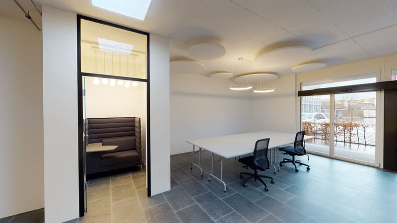 modern office room with white walls, gray floor, large windows, long white table, black chairs, glass partition, round ceiling lights