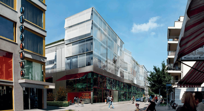 Modern building with glass facade, red awning, green roof, multiple floors, urban setting