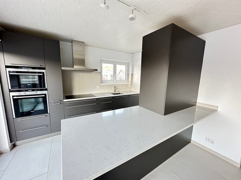 modern kitchen, white marble countertop, stainless steel appliances, gray cabinets, white tile flooring