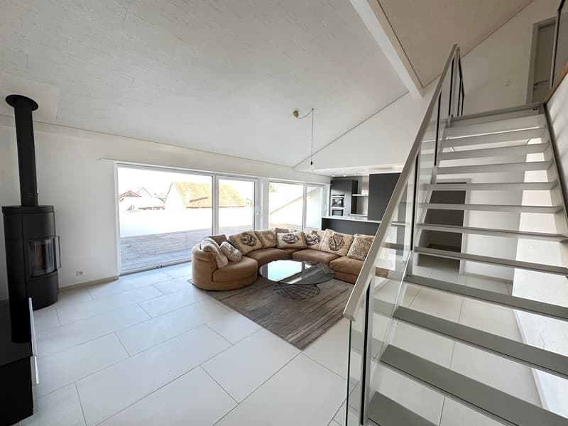 modern living room, white tiles, large windows, glass doors to balcony, sectional sofa, coffee table, fireplace