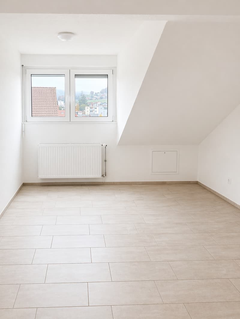 empty room, white walls, white ceiling, white tiled floor, white radiator, window with view