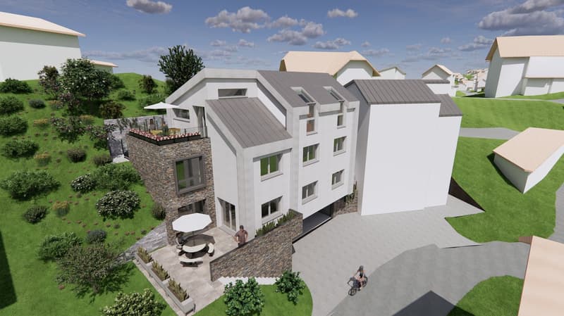The building is a two-story white residential building with gray roofing. It has a stone façade, glass windows, and a balcony with railings. There are two outdoor umbrellas, chairs, and a table set on the terrace, likely for relaxation or dining. The surr