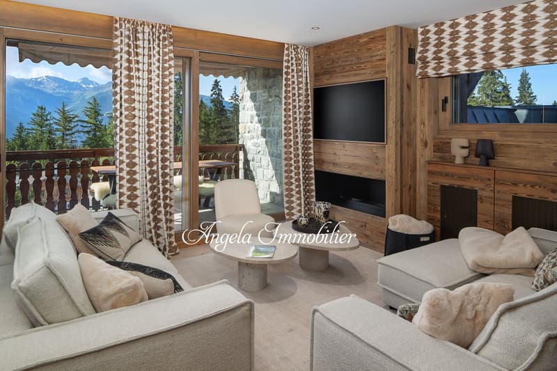 wooden walls, large windows, balcony, fireplace, sofa, coffee table, TV