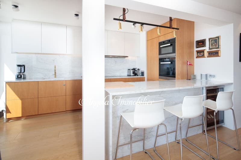 modern kitchen with wooden cabinets, marble countertop, white appliances, wooden floor