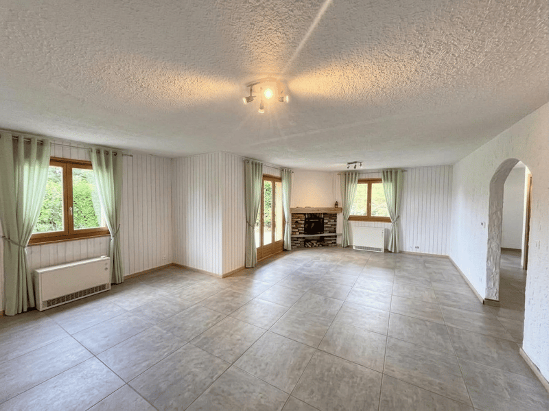 empty room, fireplace, windows, tiled floor, white walls, ceiling lights