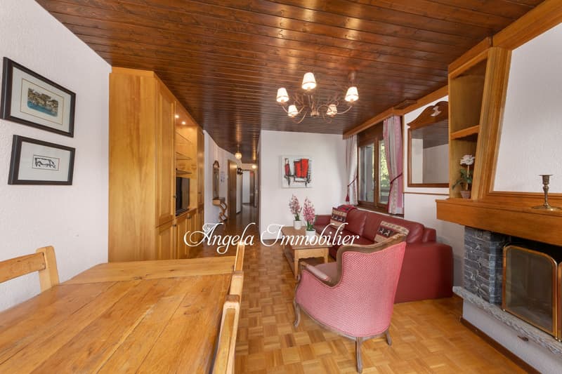 parquet floor, wooden ceiling, fireplace, chandelier, armchair, dining table, sideboard, couch, table, paintings