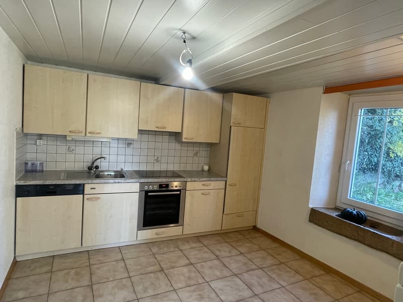 modern kitchen, tiled floor, white cabinets, built-in appliances, tiled walls, large window