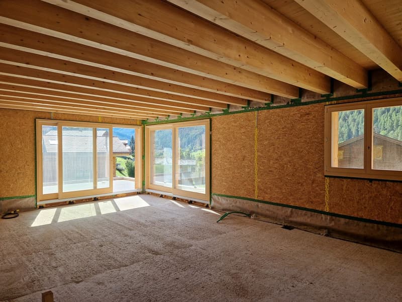 large windows, wooden beams, unfurnished