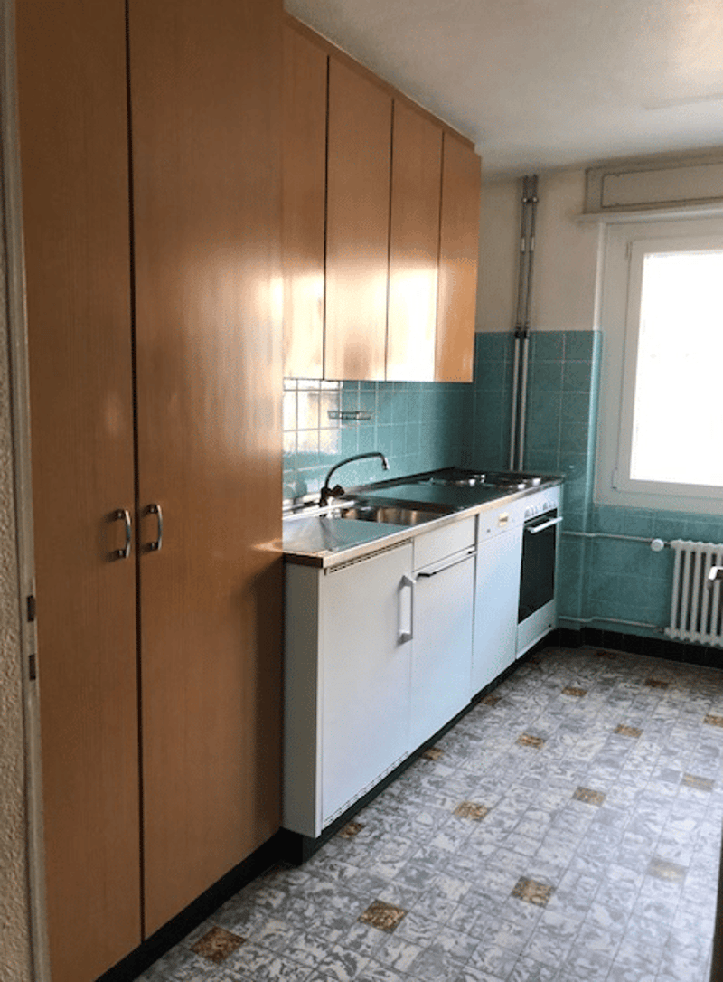 kitchen, wooden cupboards, tiled wall, oven, sink, natural light