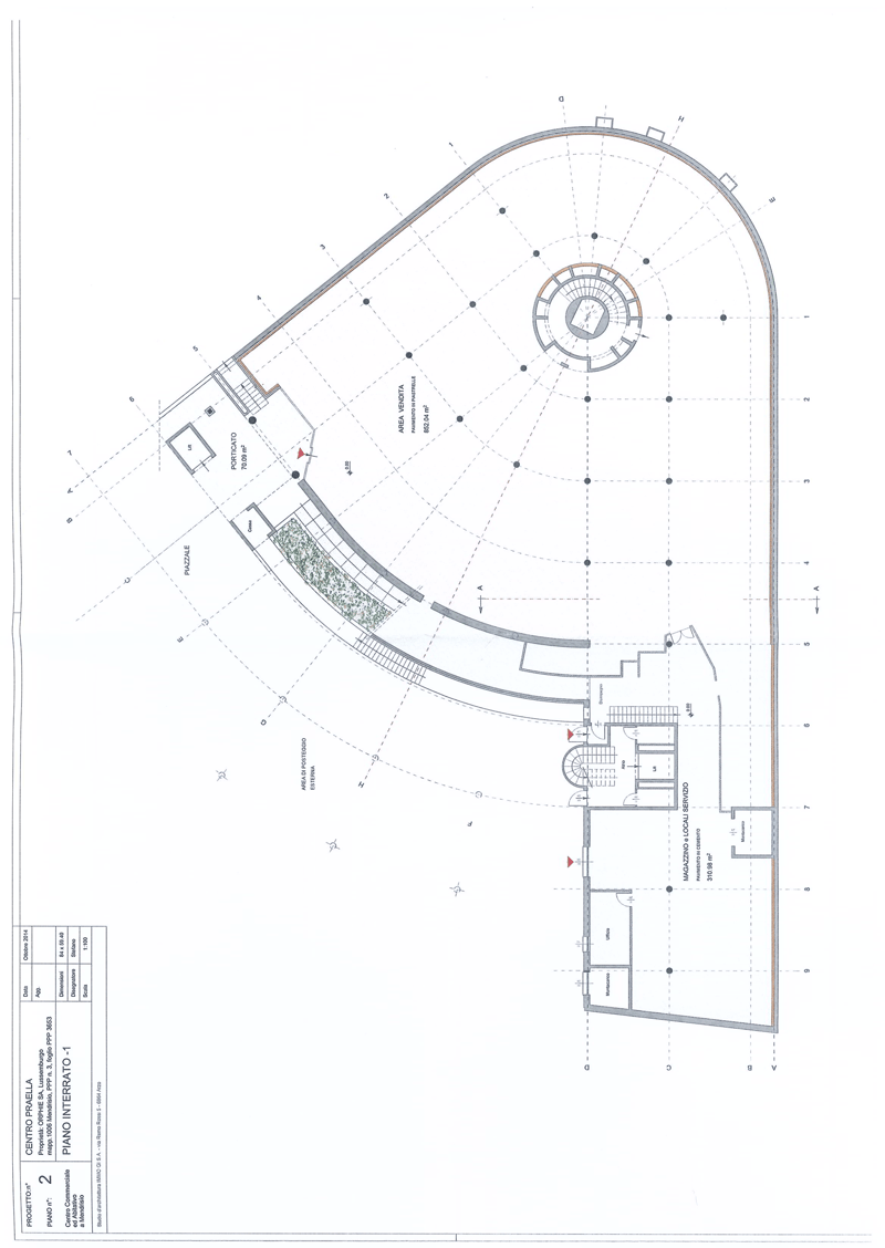 Floor plan showing a central circular area with multiple rooms around it, including a main hall, service areas, and storage rooms.