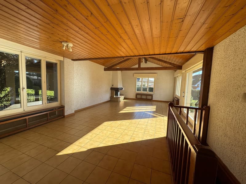 tiled floor, wooden ceiling, fireplace, windows with view